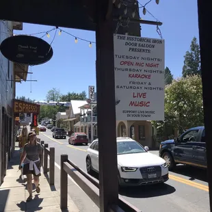 a woman walking down the sidewalk