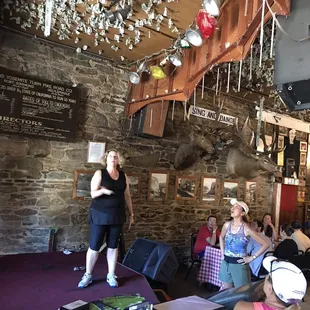 a woman standing in front of a crowd