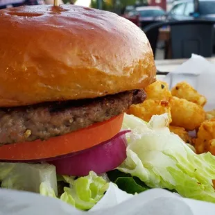 Build your own Impossible burger w/tater tots ($11). Decent, but nothing amazing. Daiya vegan cheese is also offered.