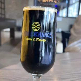 a glass of beer on a table