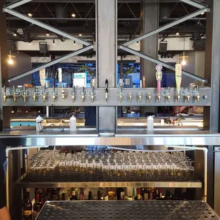 a bar with a lot of glasses on it