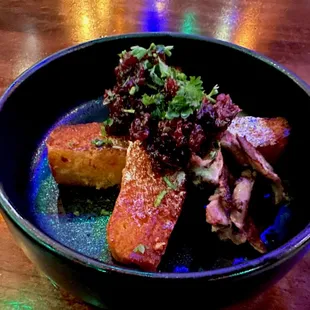 Butternut squash cornbread with Michigan honey butter, braised duck and pickled cranberries. Yum!!