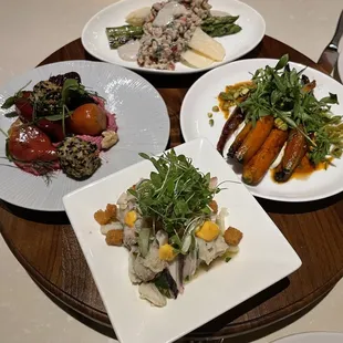 four plates of food on a table