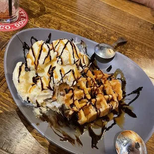 a plate of waffles and ice cream