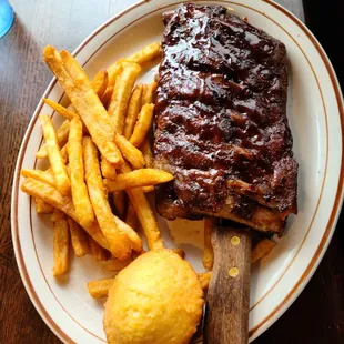 Half rack of ribs with fries and corn bread! Meat literally fell off the bone as you tried to pick it up!