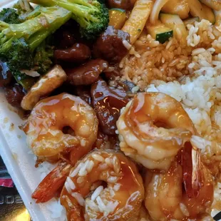 Shrimp/steak combo with side of rice and grilled veggies