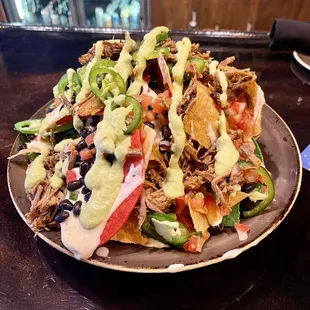 Brisket nachos are excellent! A lot of brisket and a ton of jalapeños and all the other good stuff.
