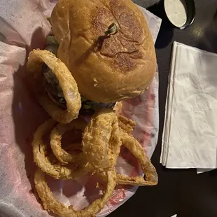 Hamburger with onions rings.