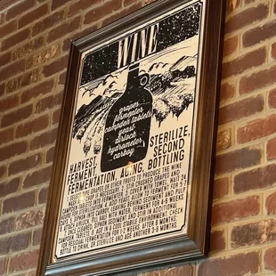 a poster on a brick wall