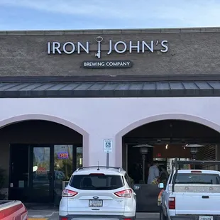 two cars parked in front of a building