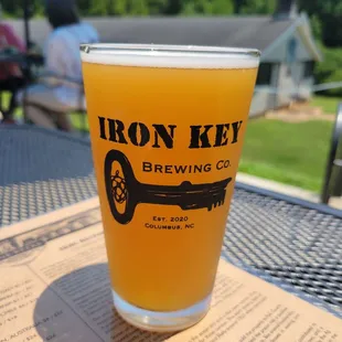 a glass of beer on a table