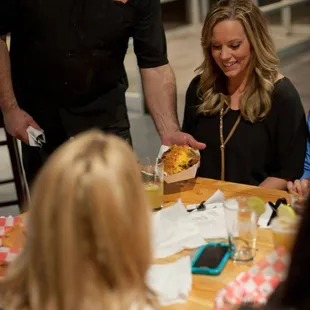 PurdyQ serves in the Tap Room