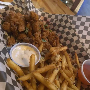 Popcorn chicken and Garlic fries. Dipping sauces for the win....siriacha ranch and sweet sauce!