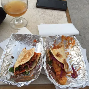 two tacos on tin foil