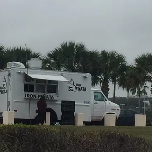 a white truck parked in a parking lot