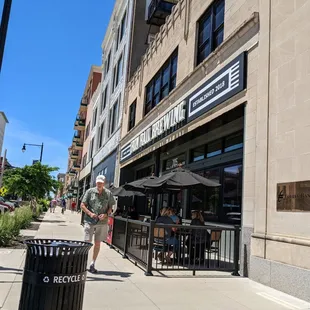 a man walking down the sidewalk
