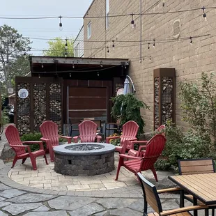 a patio with a fire pit