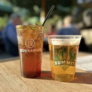 two glasses of beer and a drink