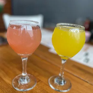 two glasses of beer on a table