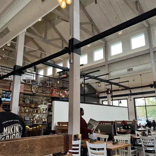 inside of a restaurant with tables and chairs