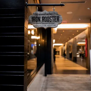 the entrance to the iron rooster