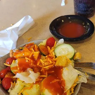 Kevin kind of salad June 2nd 2022 Regular lettuce tomatoes cucumbers cheese French dressing croutons and diet Pepsi.