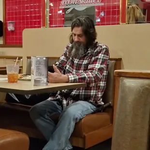 Holy man Trucker dining at Iron Skillet