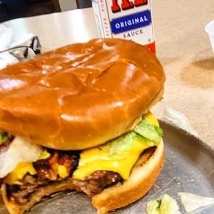 One little bite into the crispy bacon juicy meat with the A1 on it perfect