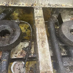 a burnt gas stove with two burners
