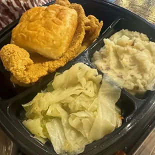 Catfish ,cabbages ,mashed potatoes and biscuit