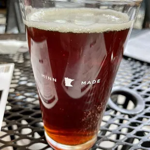 a glass of beer on a table