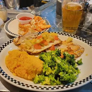 Tilapia with a pineapple salsa, rice, steamed vegetables.