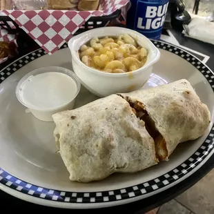 Buffalo chicken sandwich made into a wrap with blue chz on the side and mac n cheese