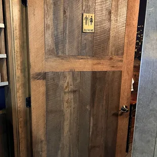 Small bathroom in the back next to the water station