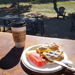 a plate of food and a cup of coffee