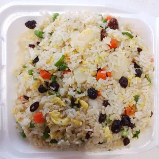 Pineapple fried rice, peas &amp; carrots, eggs, raisins.