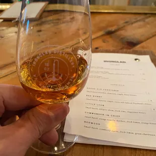 a person holding a glass of wine