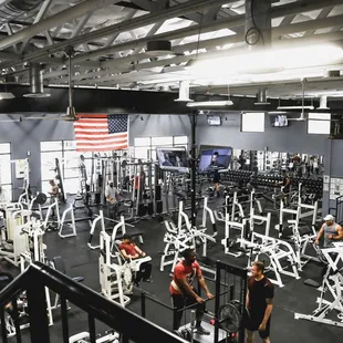 a gym with rows of weight machines