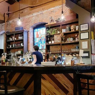 a woman sitting at the bar