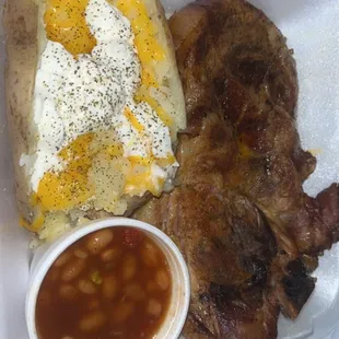 Pork steak dinner, baked beans (delicious) baked potato I seasoned and added cheese. $13 with tax. Not bad at all