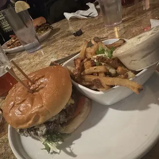 The Signet  brioche, angus reserve ground beef, bleu cheese, burgundy onions, truffle bacon, rosemary aioli, mixed greens