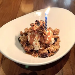 Oatmeal Raisin Cookie Crumble. Warm, crunchy oatmeal raisin cookies with ice cream, and a slight kick of bourbon caramel.