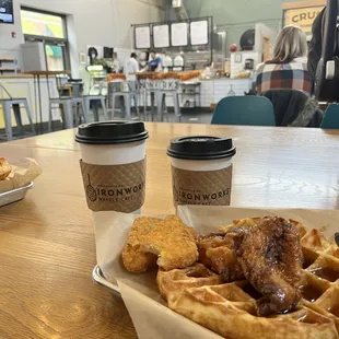a plate of waffles and a cup of coffee