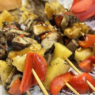 Jerk chicken skewers and pulled pork sliders with mango salsa