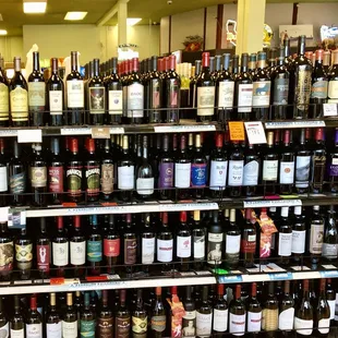 rows of wine bottles on shelves