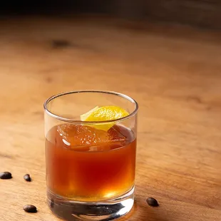 a drink in a glass on a table