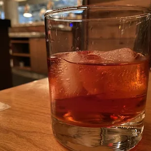 a drink in a glass with ice