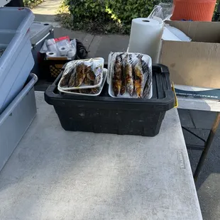 wo trays of fish on a table