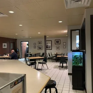a restaurant with tables and chairs