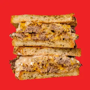 Patty Melt Sandwich - Double burger patty, American cheese, grilled onions, Irv&apos;s sauce, on toasted rye bread.